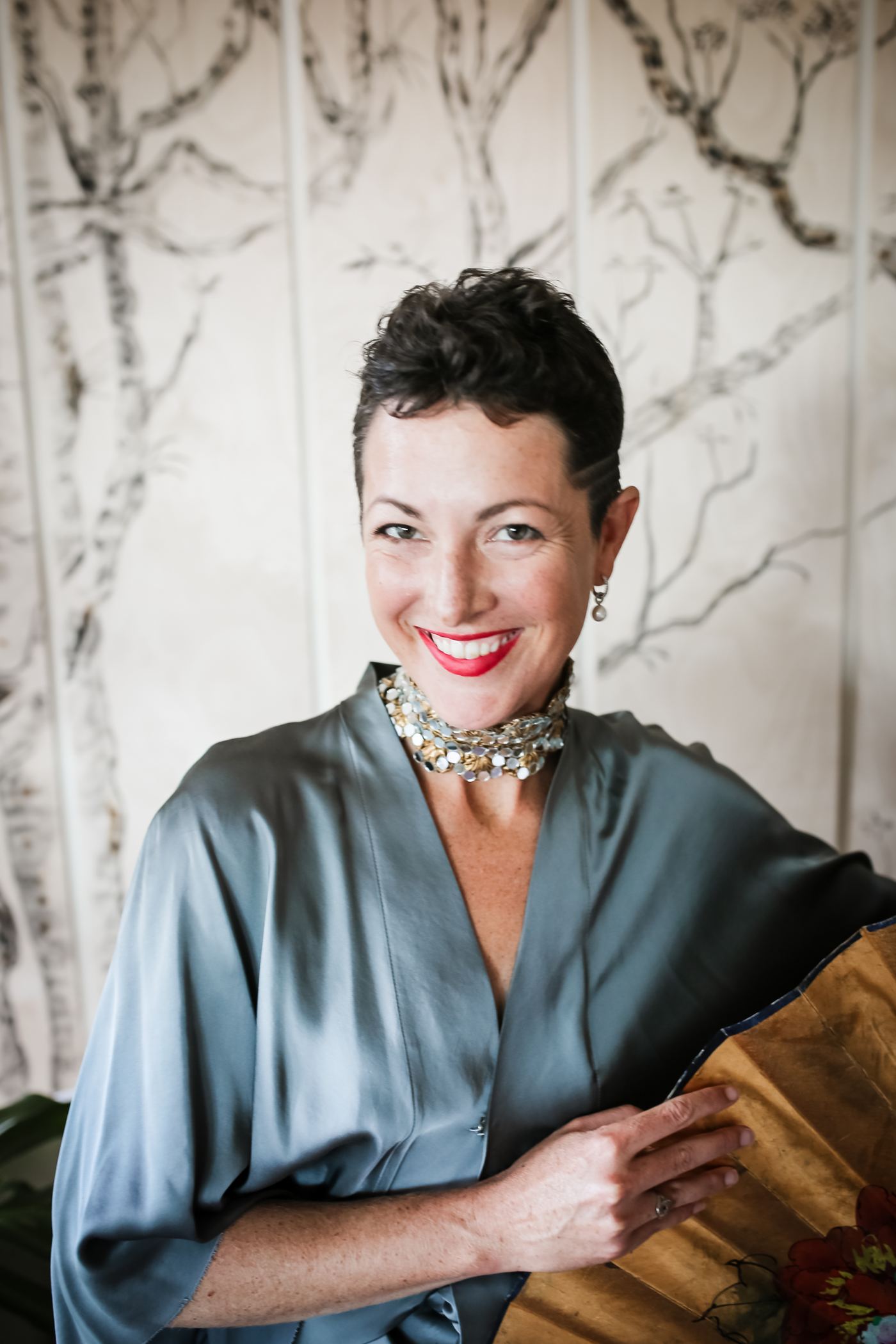 Portrait in blue-grey silk with a statement necklace