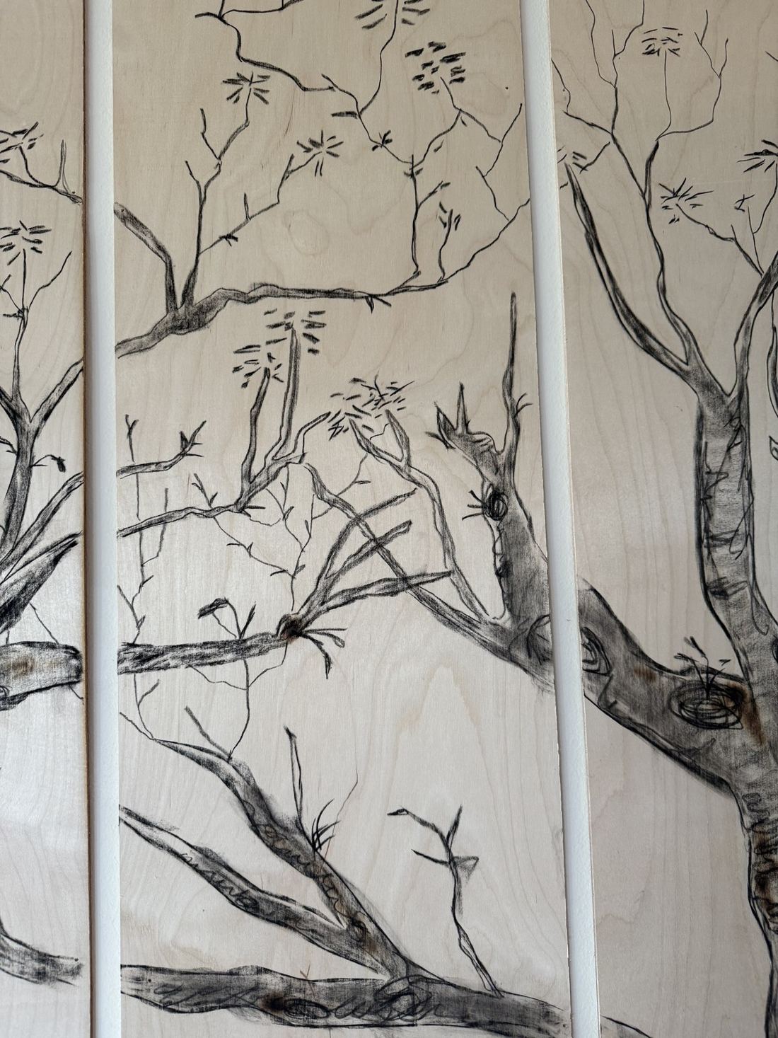 Tree panel — fire and charcoal on wood